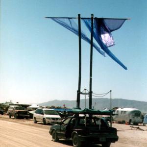 burningmanCarBlueflag